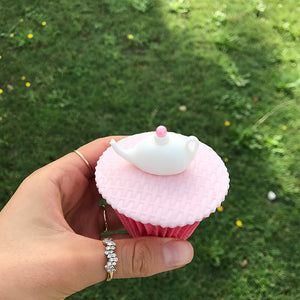 pink themed tea party cupcake with a tea pot
