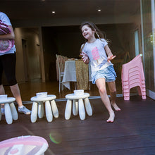 girl playing themed pamper party games at a kids party
