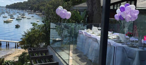 kids high tea party with balloons and party food