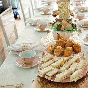 Kids High tea food on tiered stands with pink and gold crockery