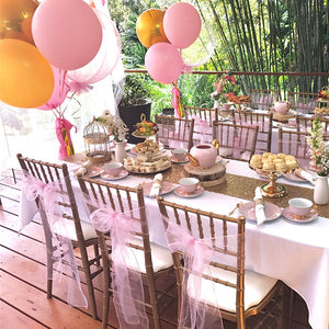 themed girls tea party with high tea food and balloons