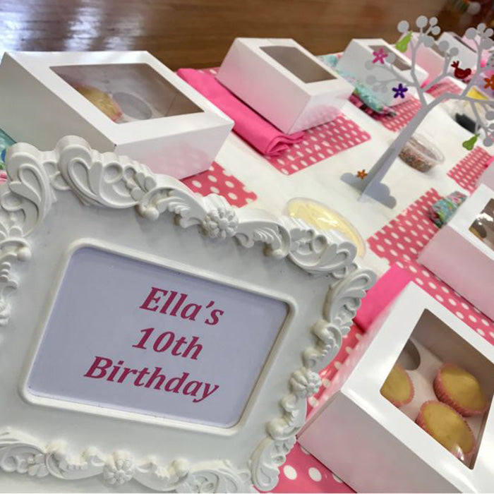 kids party entertainment with a cupcake decorating set up