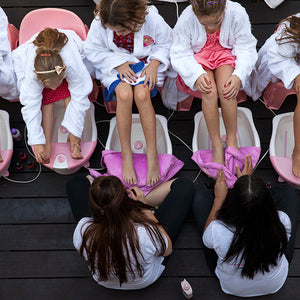 children receiving pedicures at a kids spa party by We Came Here To Party entertainers