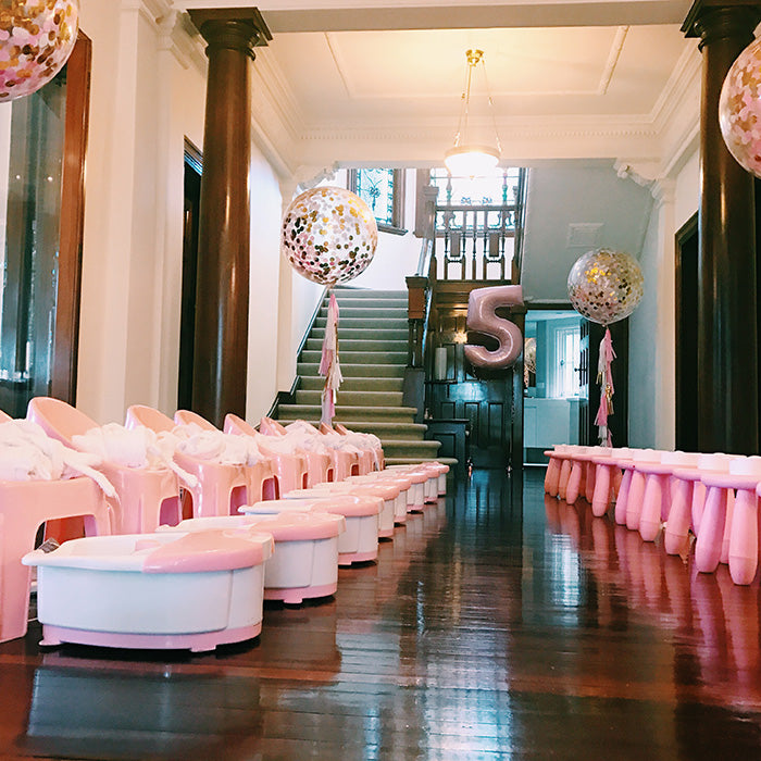 kids spa party set up with pedicure and manicure stations