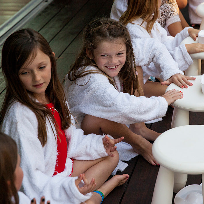 children having fun and receiving manicures at an ultimate pamper party by We Came Here To Party