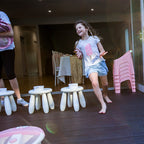 girl playing themed pamper party games at a kids party