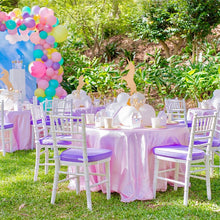 Unicorn Tea Party with pink tablecloths and white tiffany chairs